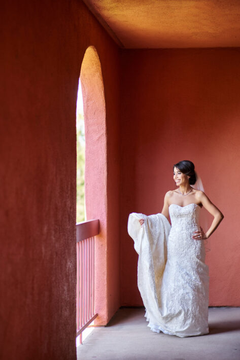 bridal portrait in front of red terra cotta wall