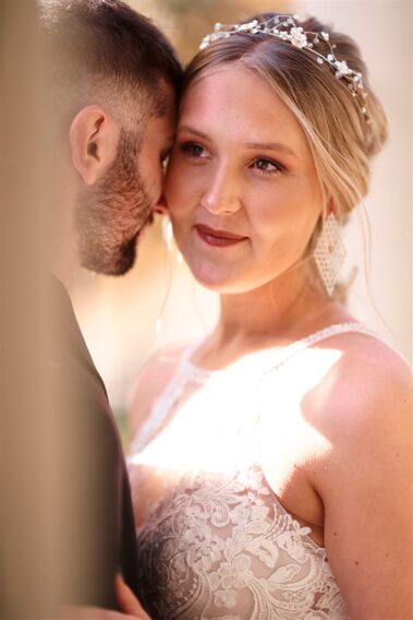 bride and groom nuzzling faces, photographed for Complete Weddings & Events, black hills receptions wedding, photographer near me, black hills wedding, fall wedding