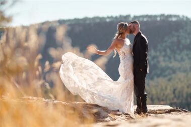 bride tossing dress train, photographed for Complete Weddings & Events, black hills receptions wedding, photographer near me, black hills wedding, fall wedding