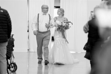 father walking daughter down aisle, winter wedding, photographed for Complete Weddings & Events, black hills barn wedding, barn at aspen acres wedding, spearfish wedding