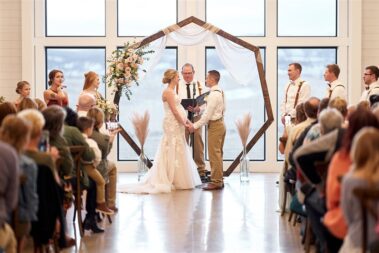 indoor wedding ceremony, winter wedding, photographed for Complete Weddings & Events, black hills barn wedding, barn at aspen acres wedding, spearfish wedding