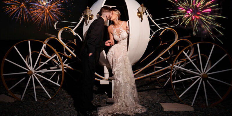 bride and groom kissing in cinderella carriage at black hills receptions wedding