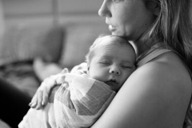 in-home newborn photos, lifestyle newborn photography, rapid city newborn photographer