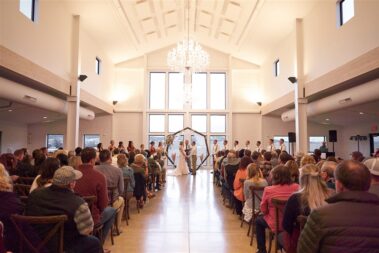 indoor wedding ceremony, winter wedding, photographed for Complete Weddings & Events, black hills barn wedding, barn at aspen acres wedding, spearfish wedding