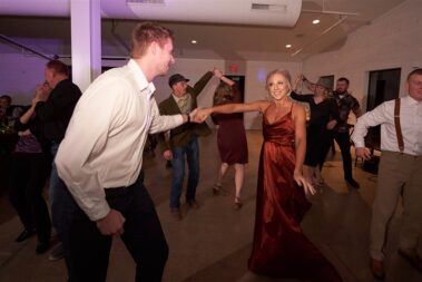 wedding guests dancing, winter wedding, photographed for Complete Weddings & Events, black hills barn wedding, barn at aspen acres wedding, spearfish wedding