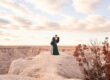 couple kissing on edge of cliff, badlands of south dakota, badlands engagement photographer