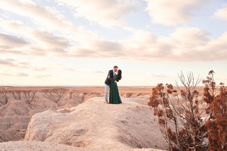 couple kissing on edge of cliff, badlands of south dakota, badlands engagement photographer