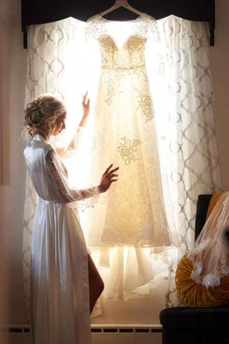 bride touching her dress