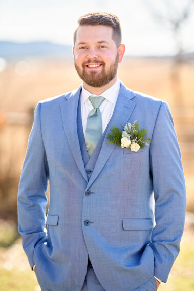 groom in a blue suit