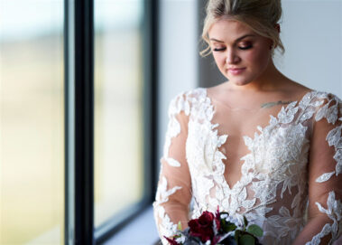 bride looking down on bouquet barn at aspen acres wedding black hills barn