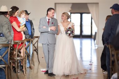 dad walking bride down aisle barn at aspen acres wedding black hills barn