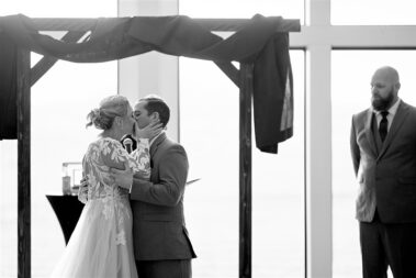 bride and groom first kiss ceremony at barn at aspen acres wedding black hills barn