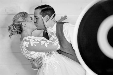 bride and groom at photobooth barn at aspen acres wedding black hills barn