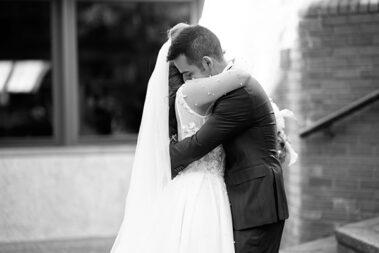 bride and groom hug after first look