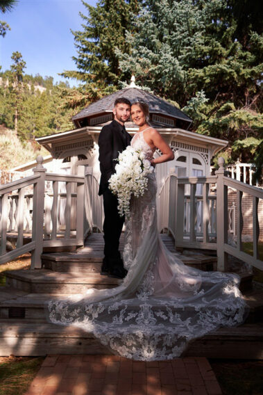 bride and groom in front of bridal gazebo at black hills receptions wedding