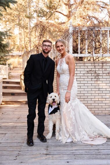 bride and groom with their dog at black hills receptions wedding