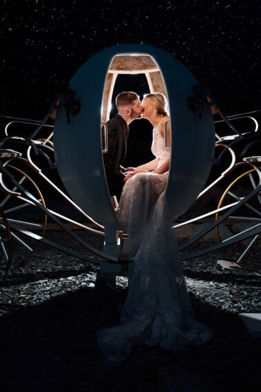 bride and groom kissing in cinderella carriage at black hills receptions wedding