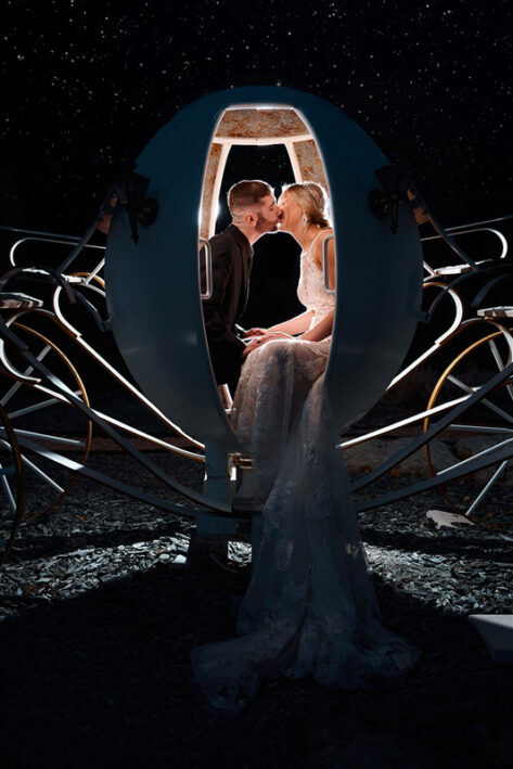 bride and groom kissing in cinderella carriage at black hills receptions wedding